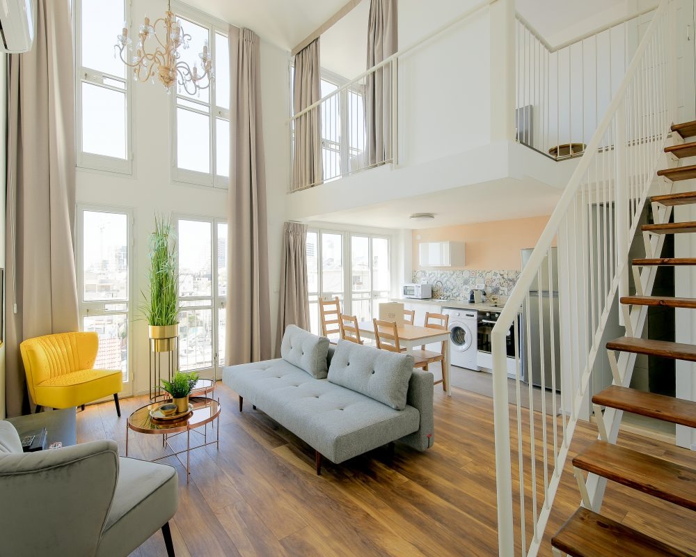 Luxury duplex apartment with high ceilings and chandelier