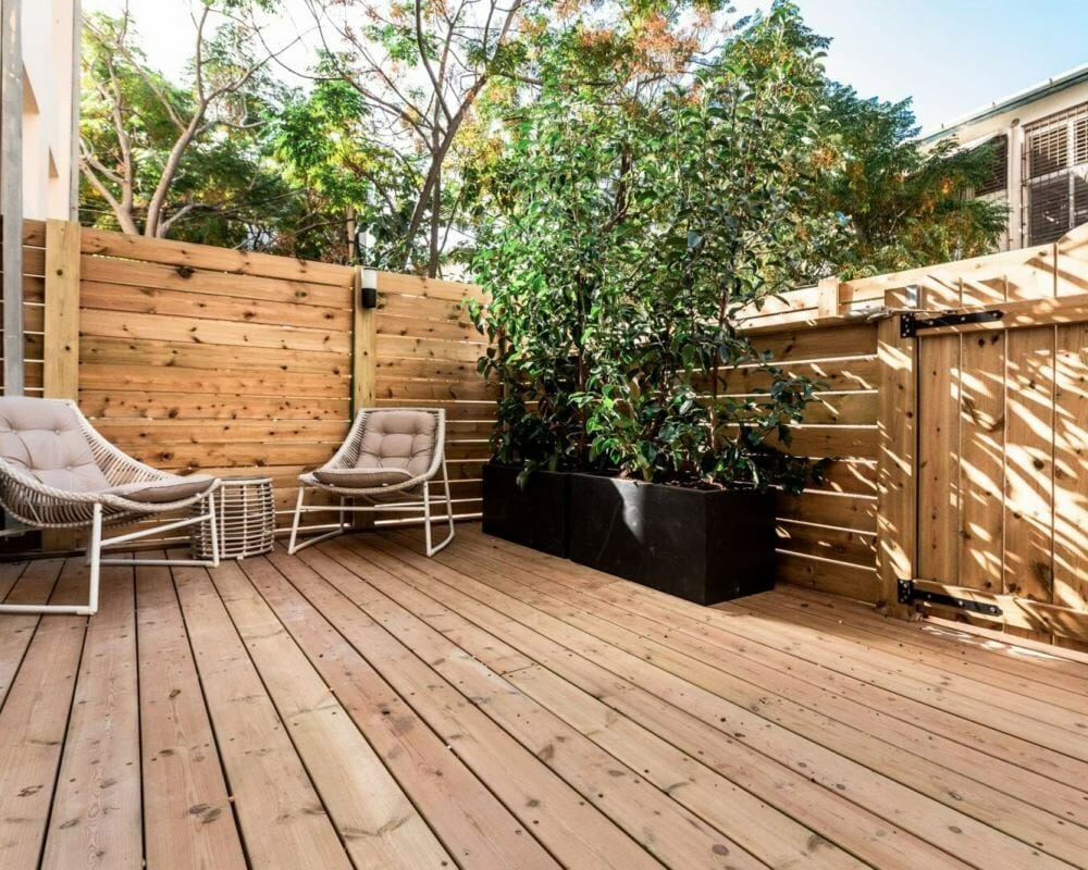 Garden patio with plants and relaxation chairs