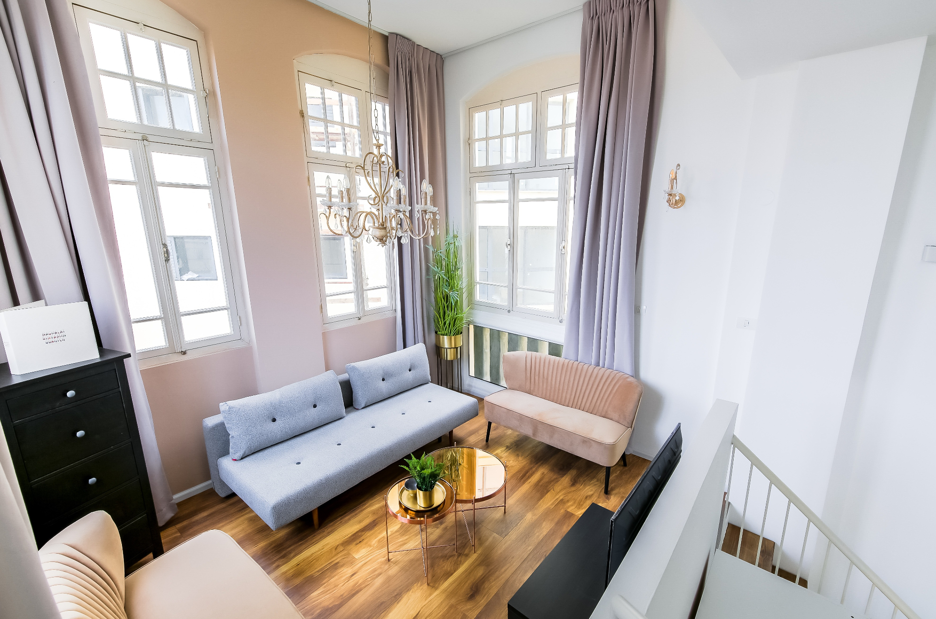 Elegant living room with high ceilings and chandelier